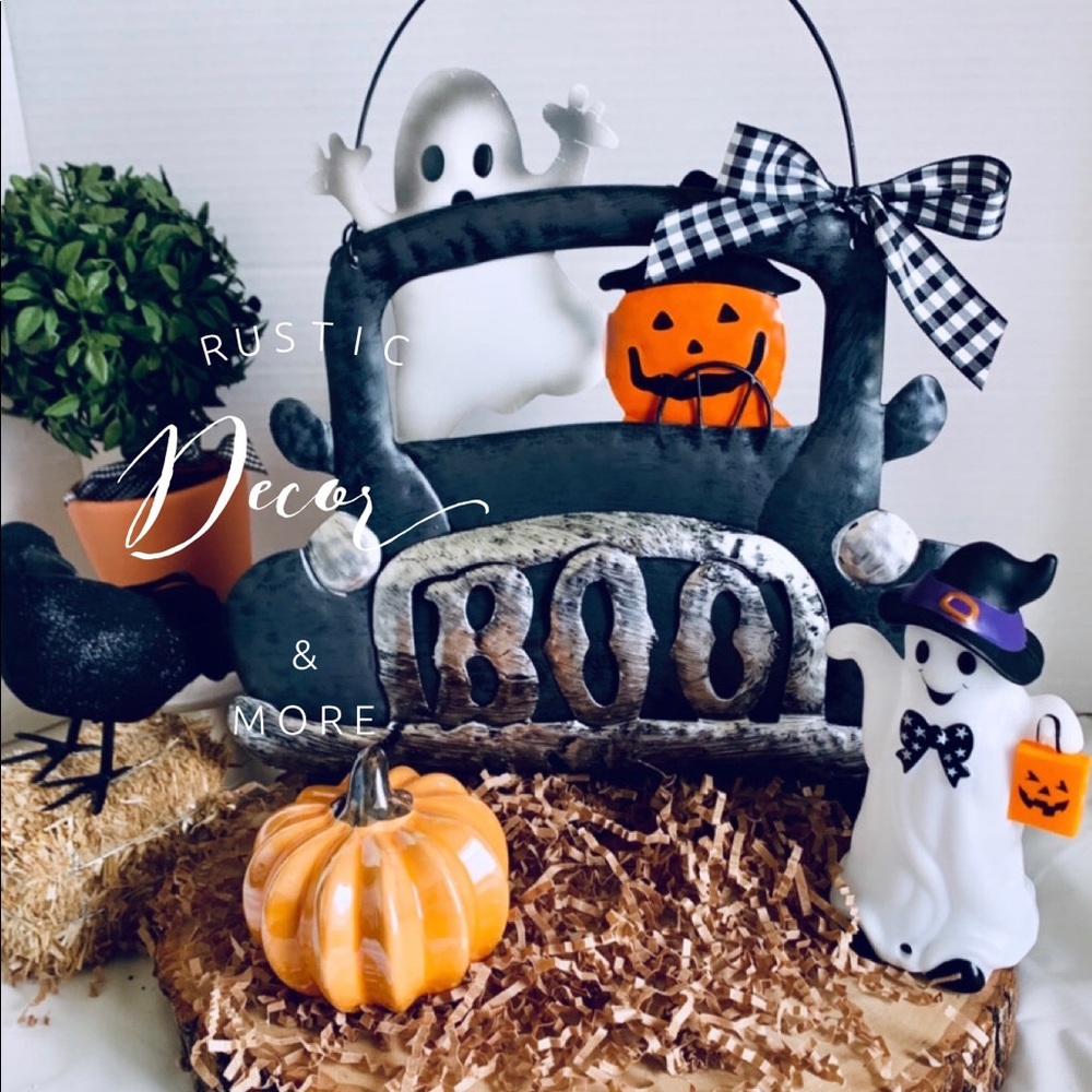 Farmhouse Black truck with trick or treaters